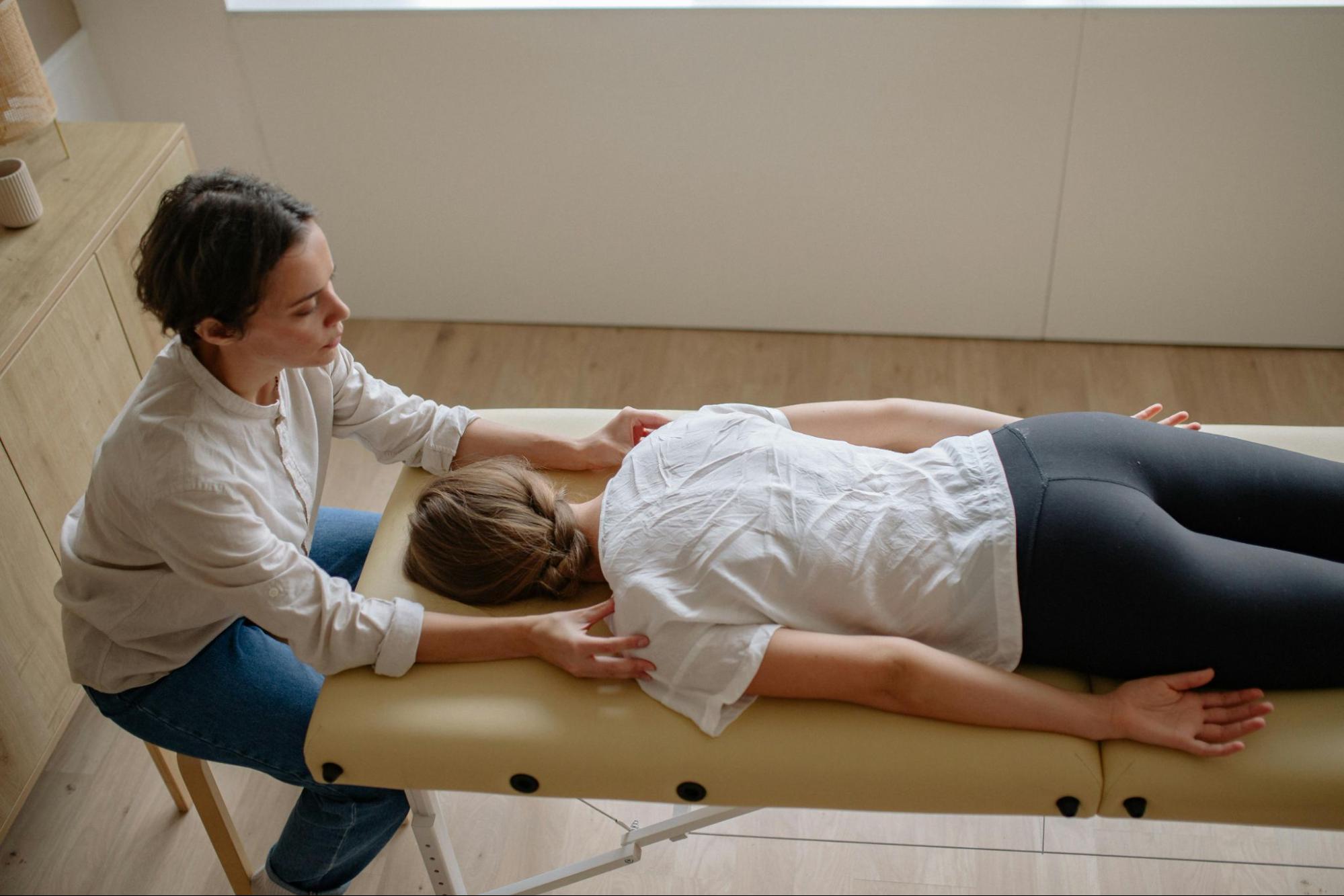 Free Motion therapist giving post surgery massage therapy to Patient